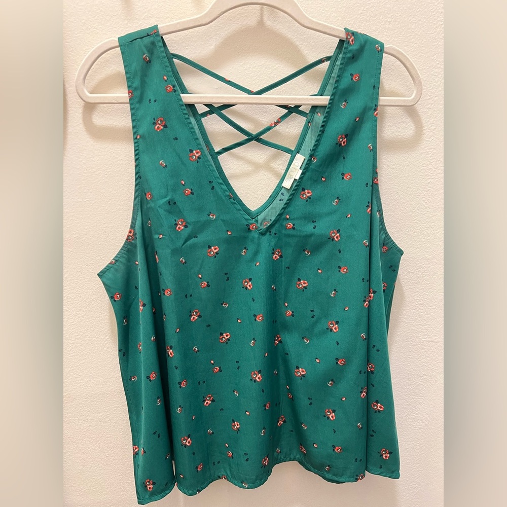 Emerald green tank with pink florals. Cute detail in the back. Lose fit